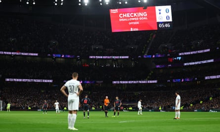 The big screen displays a VAR review message