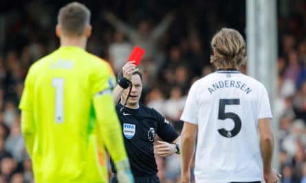 Fulham’s Joachim Andersen (right) is shown a red card by referee Darren England with Bernd Leno remonstrating