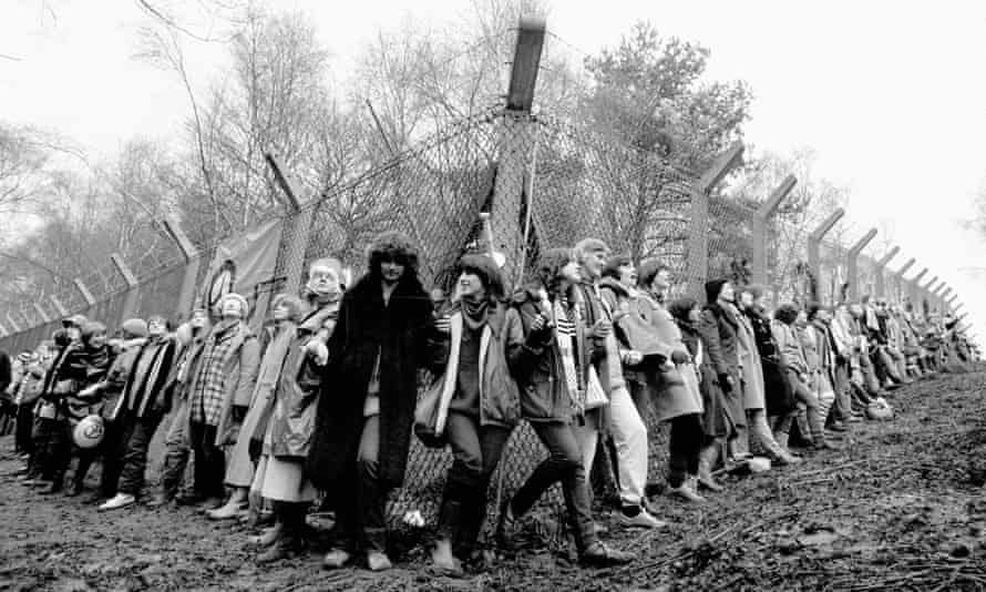 Peace activists chain themselves to a fence surrounding RAF Greenham Common in 1981.