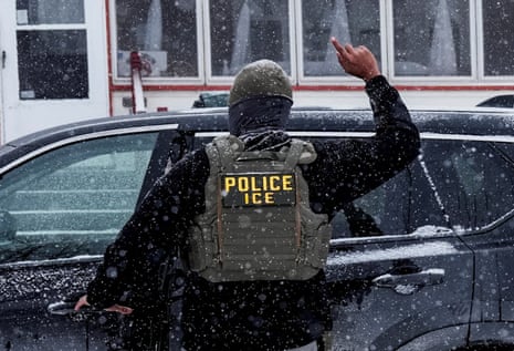 An ICE agent moments after detaining a man during an immigration raid in Minneapolis in January.