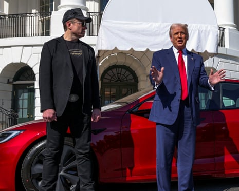 US President Donald Trump views a Tesla car at the White House in Washington next to Tesla chief executive Elon Musk in March – before they fell out.