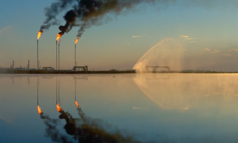 Fires burn from the tops of tall stacks at Tengiz oilfield in Kazakhstan.
