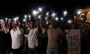 People hold their mobile phones with flash on during a vigil in Ciudad Juarez, Chihuahua state, on August 03, 2019, after a mass shooting which left 20 people dead in El Paso, Texas.