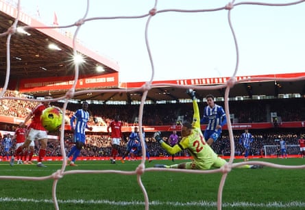 Maxim De Cuyper scores Brighton’s first goal against Nottingham Forest's Matz Sels.