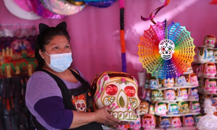Merchants in the Jamaica market offer their products for the Day of the Dead festivities, in Mexico City.