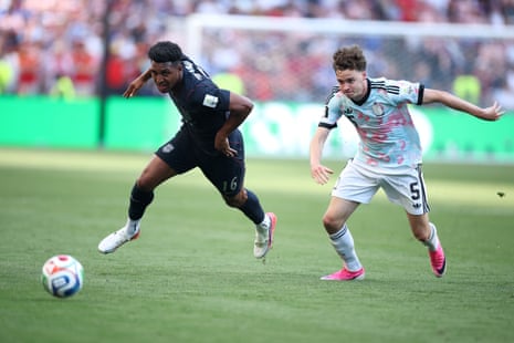 Alex Freeman competes for the ball against Maxim De Cuyper.