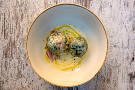 Traditional Tyrolean spinach dumplings with cream cheese and speck