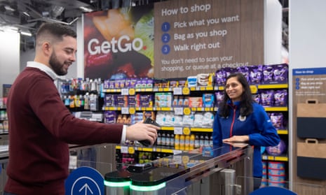Shopper using smartphoneat gates of GetGo store
