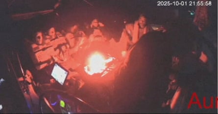 Low-resolution still of camera footage on board a boat.