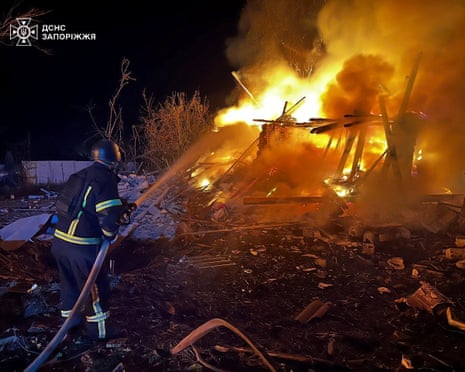 A firefighter works at the site of buildings hit during the Russian air strike, amid Russia's attack on Ukraine, in Zaporizhzhia, Ukraine.