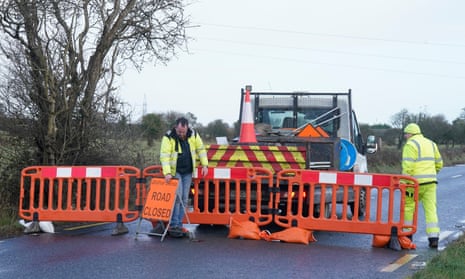 Crews from ESB Networks put road closures in place near Galway airport as they work to repair power lines damaged during Storm Isha.