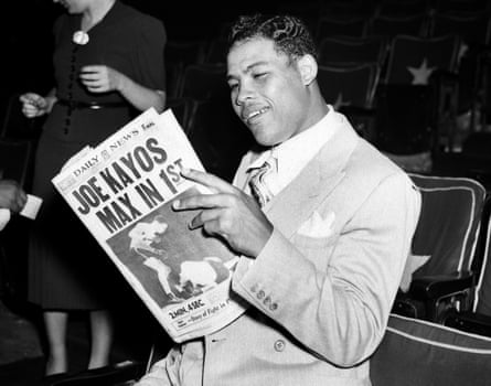Joe Louis admires his work after the second Max Schmeling fight in 1938.