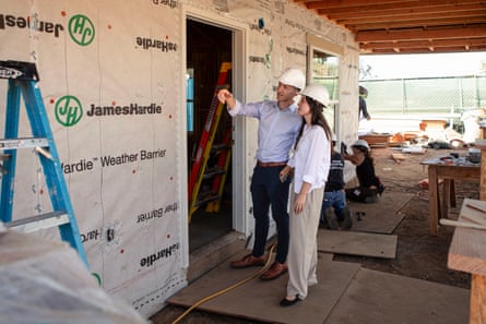 people wearing hard hats next to construction area