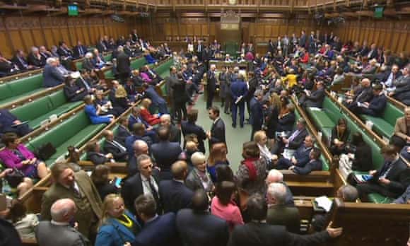 MPs filter back into the House of Commons from the lobby after voting on the article 50 bill.