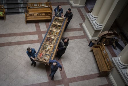 A section of the Bohorodchany Iconostasis in the Andrey Sheptytsky National Museum in Kyiv is moved to safety in March.