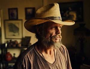 Clayton E Penland at home. He lives without running water or electricity as work is so scarce he cannot afford it. It gets down to -20F in the winter.