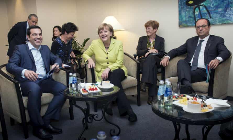 German Chancellor Angela Merkel and French President Francois Hollande (R) attend a meeting with Greek Prime Minister Alexis Tsipras (L) in Riga, May 21, 2015.