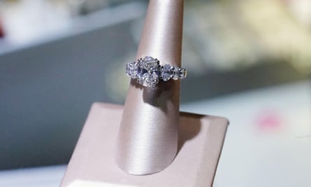 A ring containing lab-grown diamonds on a jewellery stand. 