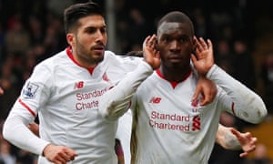 Benteke celebrates with Can after scoring the winning goal from the spot in extra time.