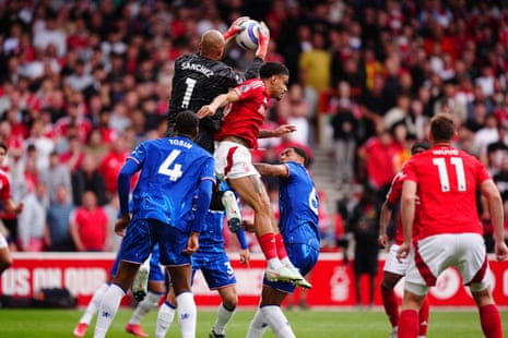 Robert Sanchez claims the ball under pressure from Morgan Gibbs-White.