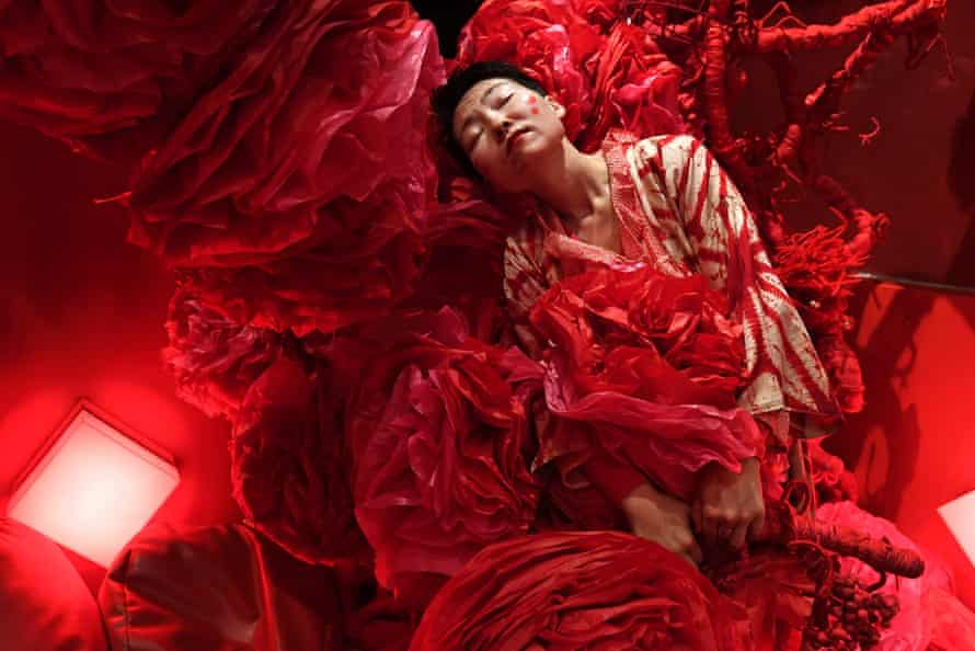 Hiromi Tango performs in her installation titled Red Room, at the Sydney Contemporary Art Fair in 2017.