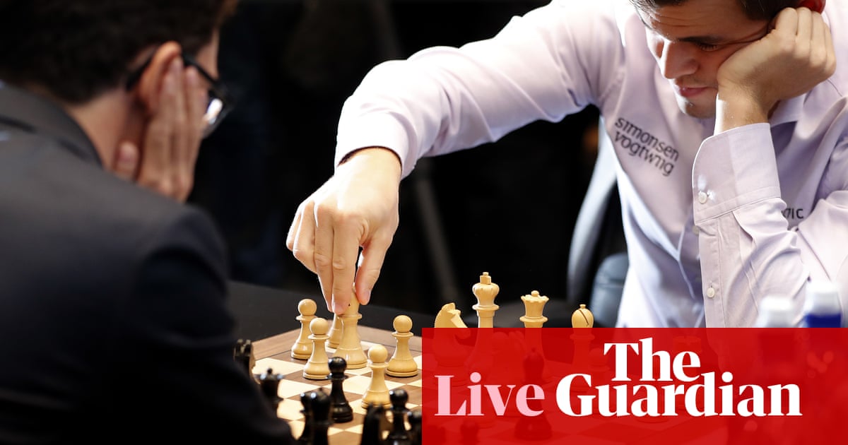 Carlsen defeats Caruana to retain World Chess Championship in tie-breakers – as it happened