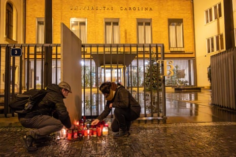 People light candles in front of Charles University main building following the shooting at one of it’s buildings in Prague.