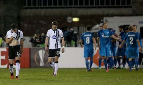 Dundalk’s Robbie Benson and Ronan Finn look dejected after Zenit’s Giuliano scores the winning goal.