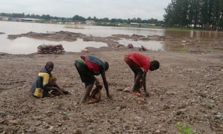 Children digging for  cobalt near Lake Malo in DRC.