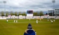 A spectator watches from the stands during day one at Southampton, where Hampshire are hosting Warwickshire.