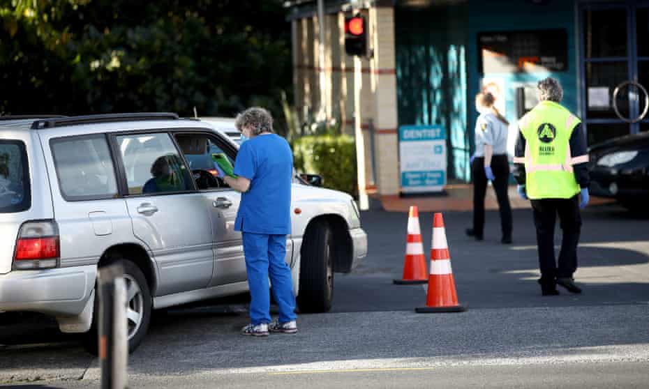 Queues of cars wait outside the St Lukes Covid-19 testing centre in Auckland