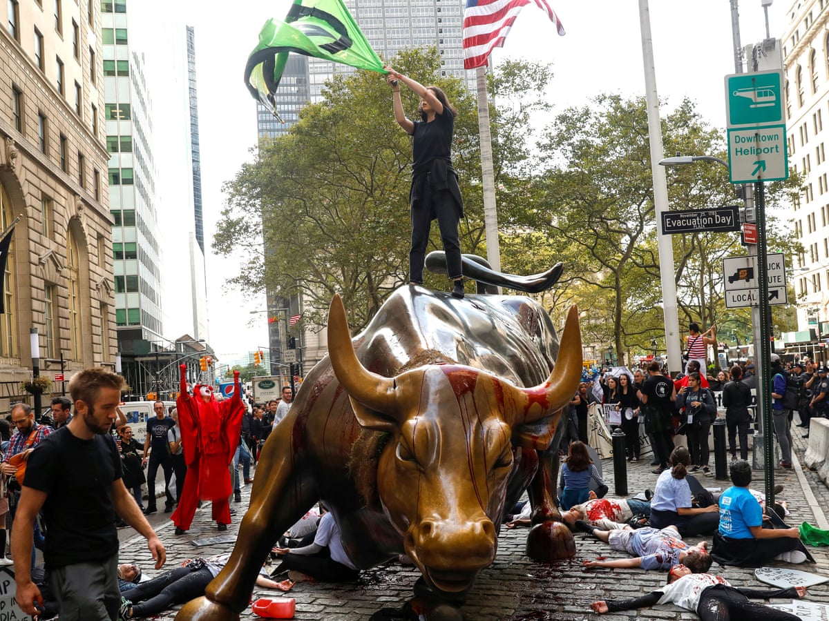 Extinction Rebellion Protesters Pour Fake Blood Over New York S Capitalist Bull Us News The Guardian