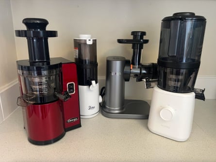 Juicers lined up on a countertop