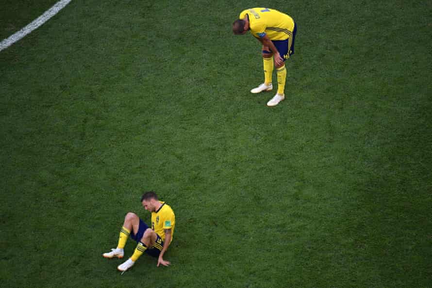 Sweden’s Marcus Berg  and Andreas Granqvist react after their loss