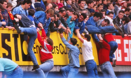 Fans are pulled to safety above the Leppings Lane terrace.