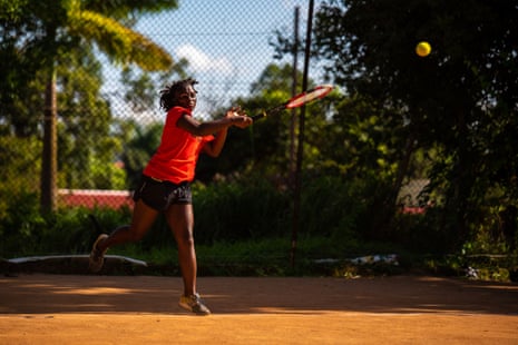 Judith Nalukwago returns a forehand during a match at Makerere University guesthouse tennis courts