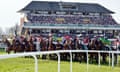 Horses and jockeys line up at the start of the Grand National steeplechase at Aintree racecourse on 15 April 2023.