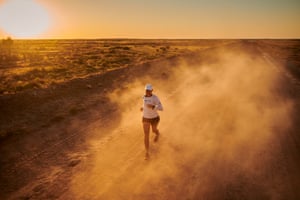 Guli runs marathon No 9, near Mungeranie, South Australia. The runner frequently negotiated dust storms while running in the desert.