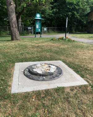 This photo provided by WROC-TV shows the remnants of a Frederick Douglass statue ripped from its base at a park in Rochester, New York