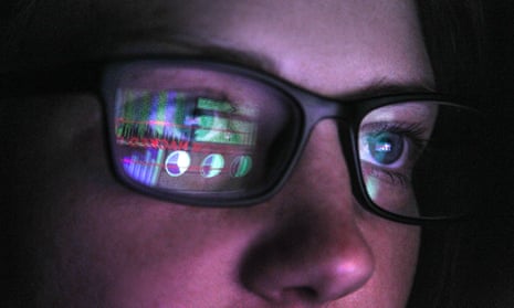 A computer screen is reflected in glasses