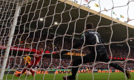 Hwang Hee-chan scores the opening goal for Wolves against Liverpool