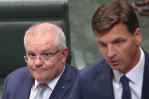 The prime minister Scott Morrison watches Emissions reduction minister Angus Taylor during question time on Wednesday 4th December 2019.