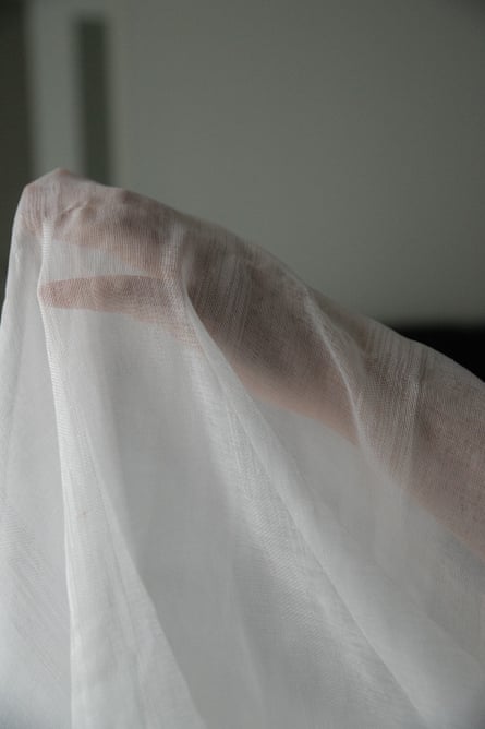 A hand under muslin cloth
