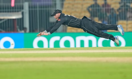 New Zealand's Glenn Phillips dives to field the ball.