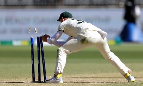 Marnus Labuschagne of Australia knocks over the stumps to run out Saud Shakeel of Pakistan