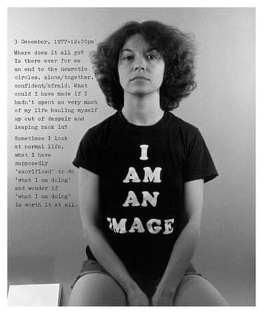 A woman sitting down.
