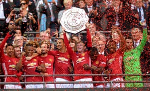 Wayne Rooney lifts the 2016 Community Shield Trophy.