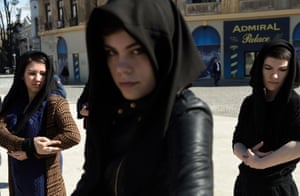 Bucharest, Romania Women wearing black scarfs adopt a mother care posture during a flash mob