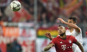 Bayern Munich’s Arturo Vidal, front, and Benfica’s Jonas vie for the ball.