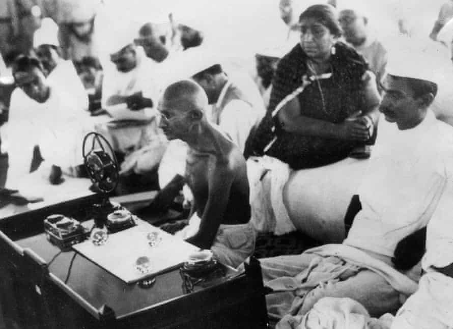 Mohandas Karamchand Gandhi (centre), also known as Mahatma (Great soul) speaking during a meeting of the All-India Congress in Bombay (now Mumbai) in 1942.